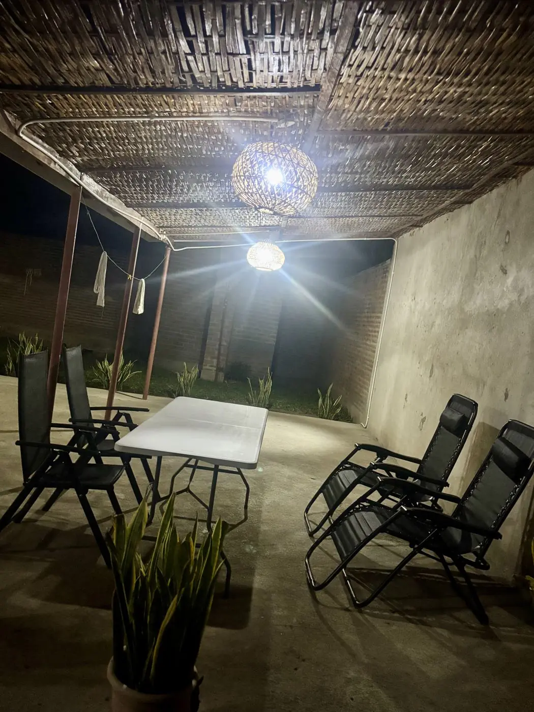 The same covered patio lit at night