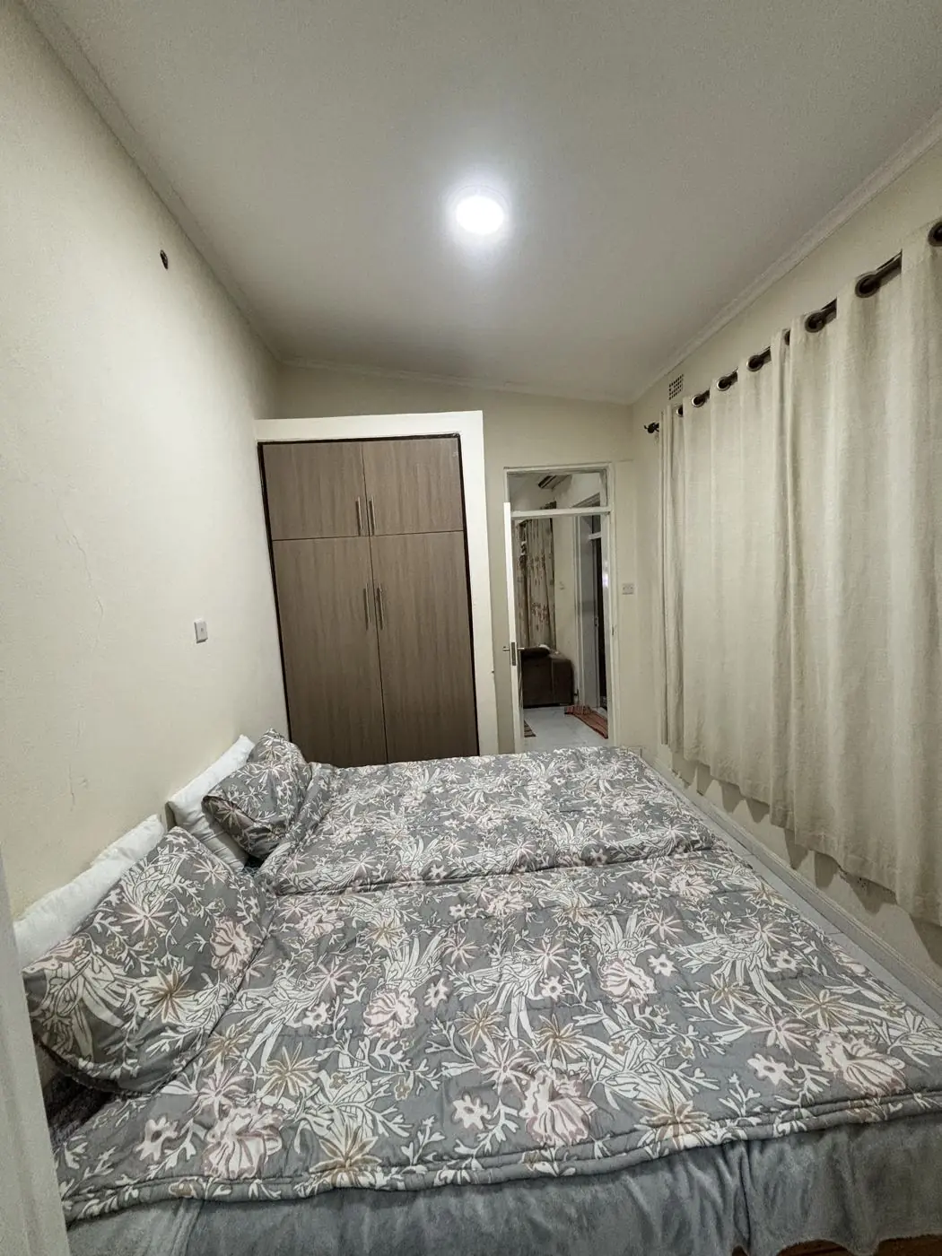 Bedroom with painted walls and fitted wardrobe