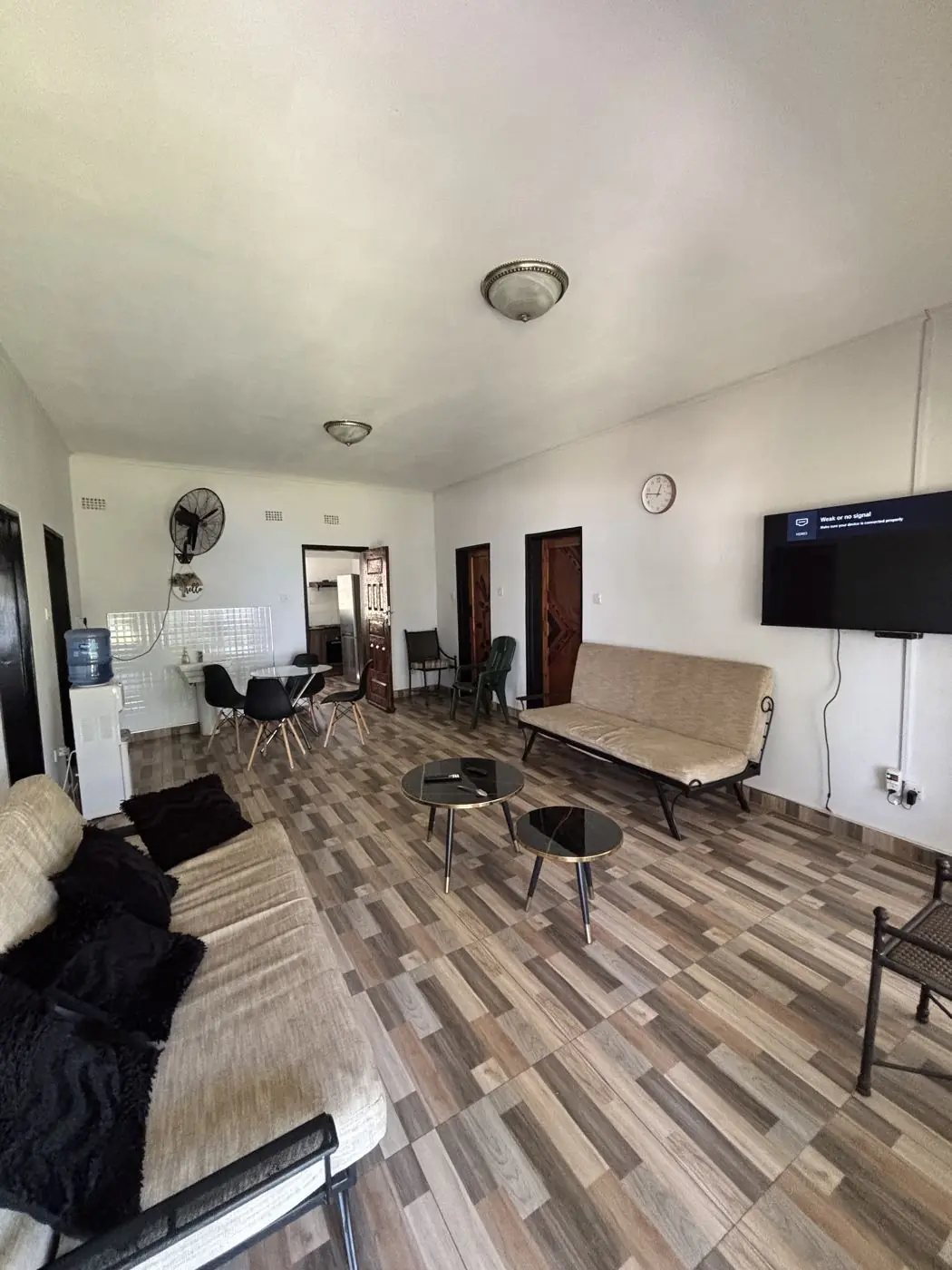 Open-plan living area with patterned tiled floor