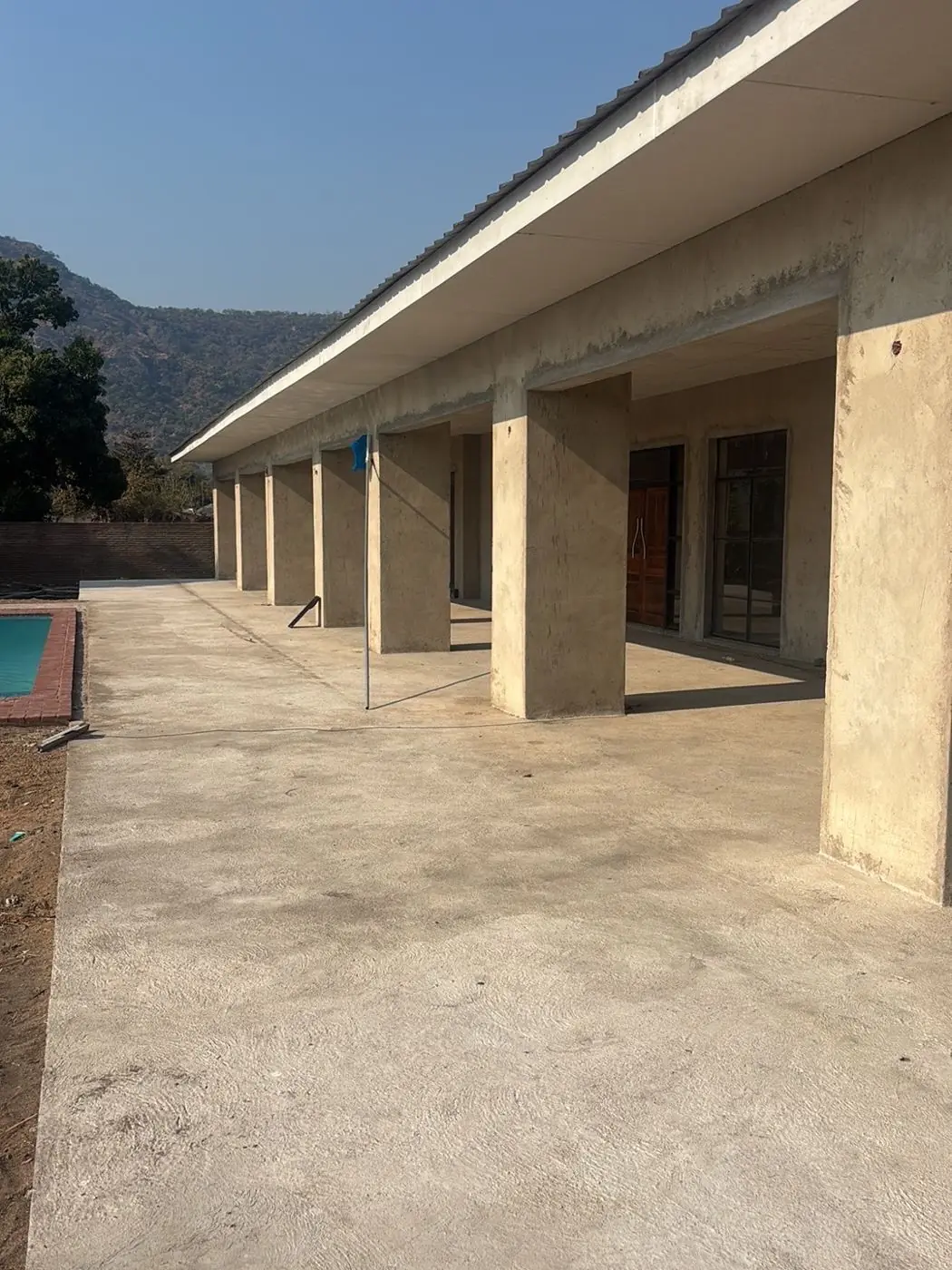 Covered colonnade along the resort lodge, awaiting finishing