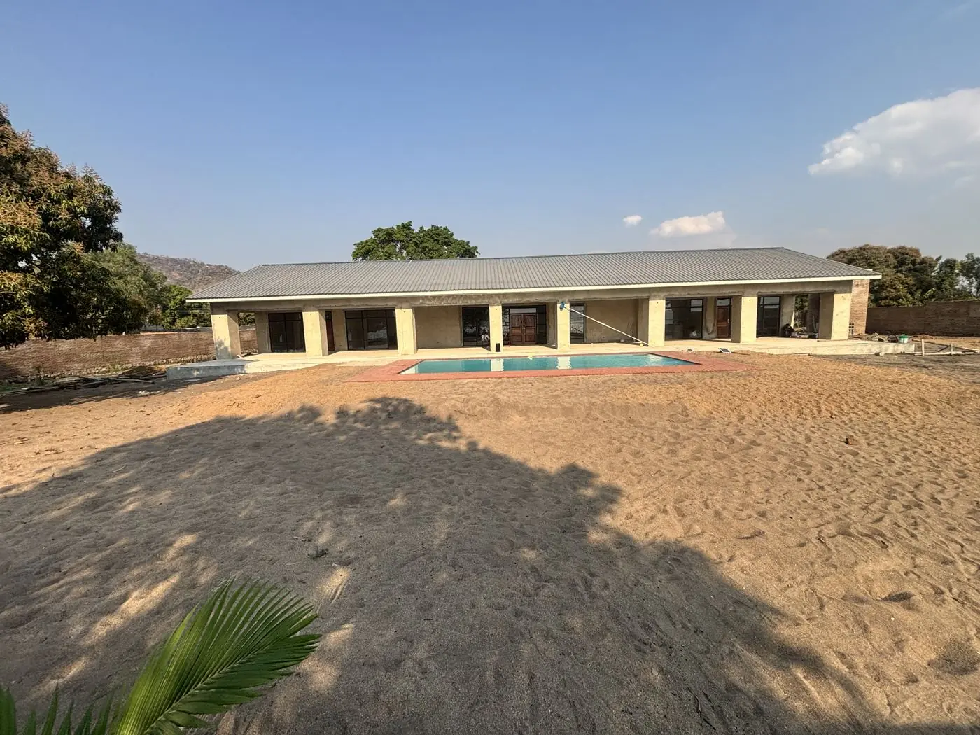 Lakeside resort main lodge with swimming pool, under construction