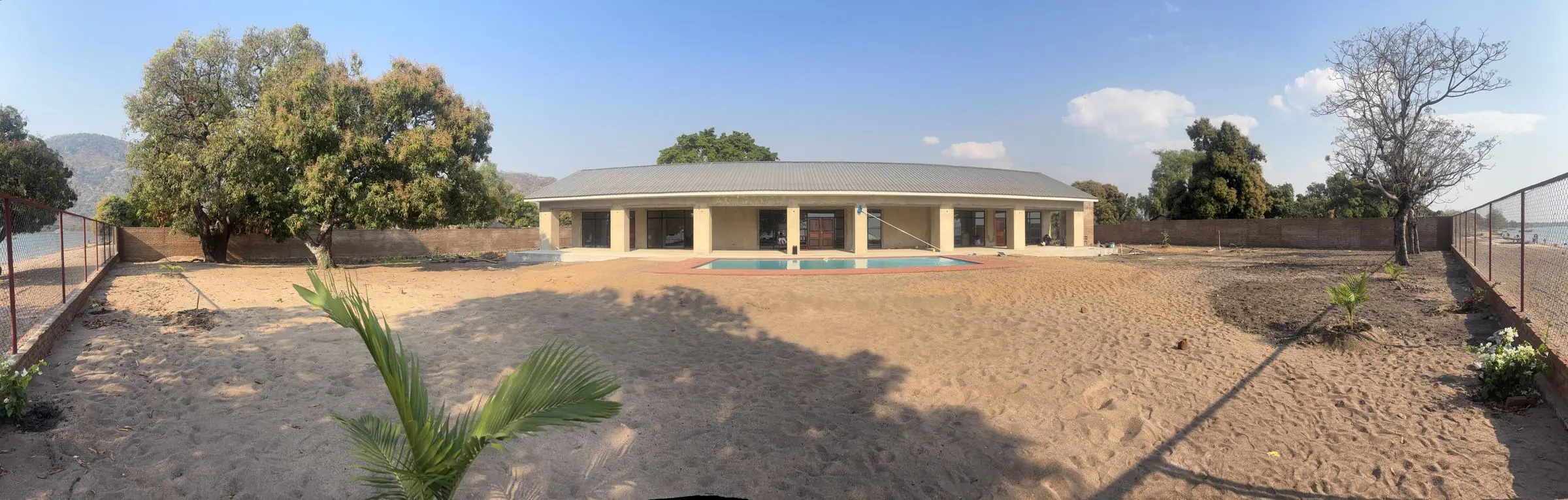 The lakeside resort site with the main lodge and pool under construction
